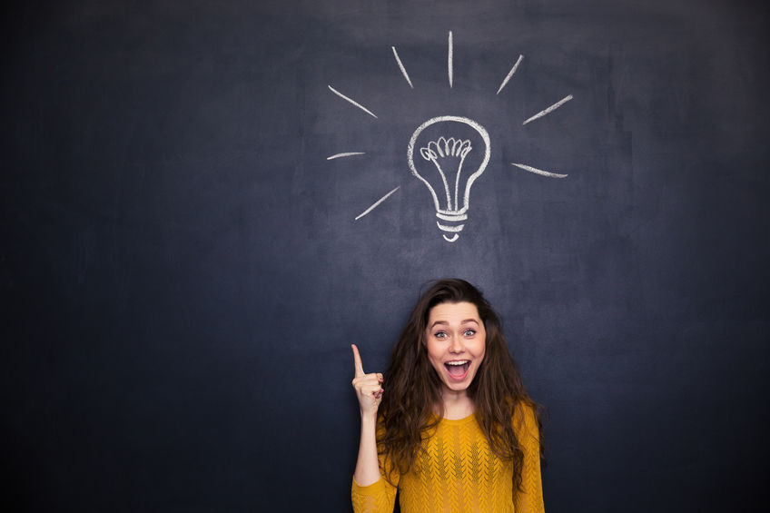 a girl with a lightbulb above her head representing the knowledge one gathers regarding translation services
