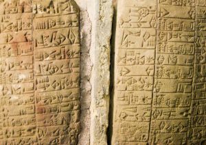 A cunieform stone tablet carved with the translation of The Epic of Gilgamesh. The first record of translation in history. 